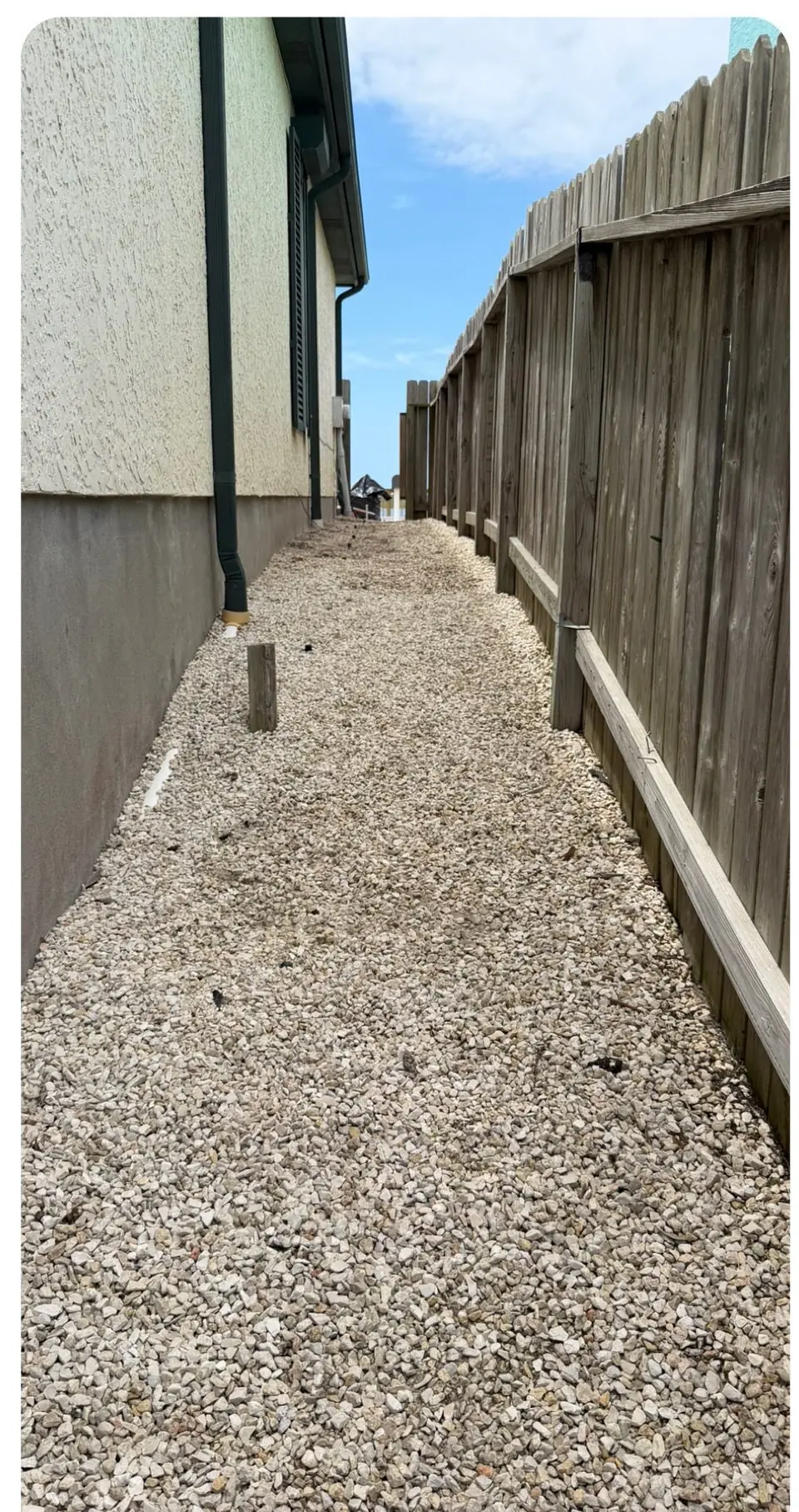 The same gravel side path clean and weed free after SiteHarbor treatment